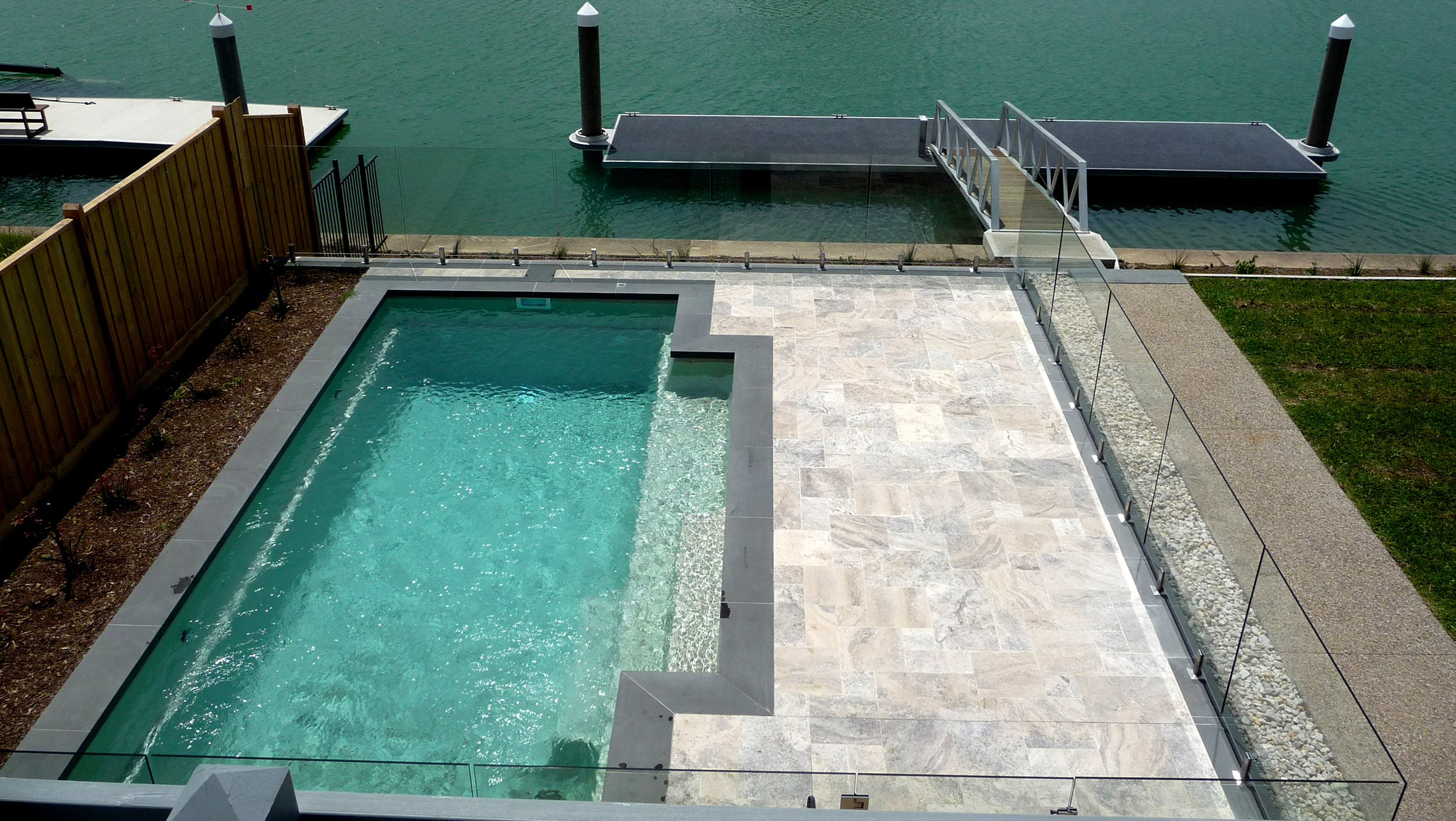  Silver Unfilled Travertine with Bluestone Copers around Pool 