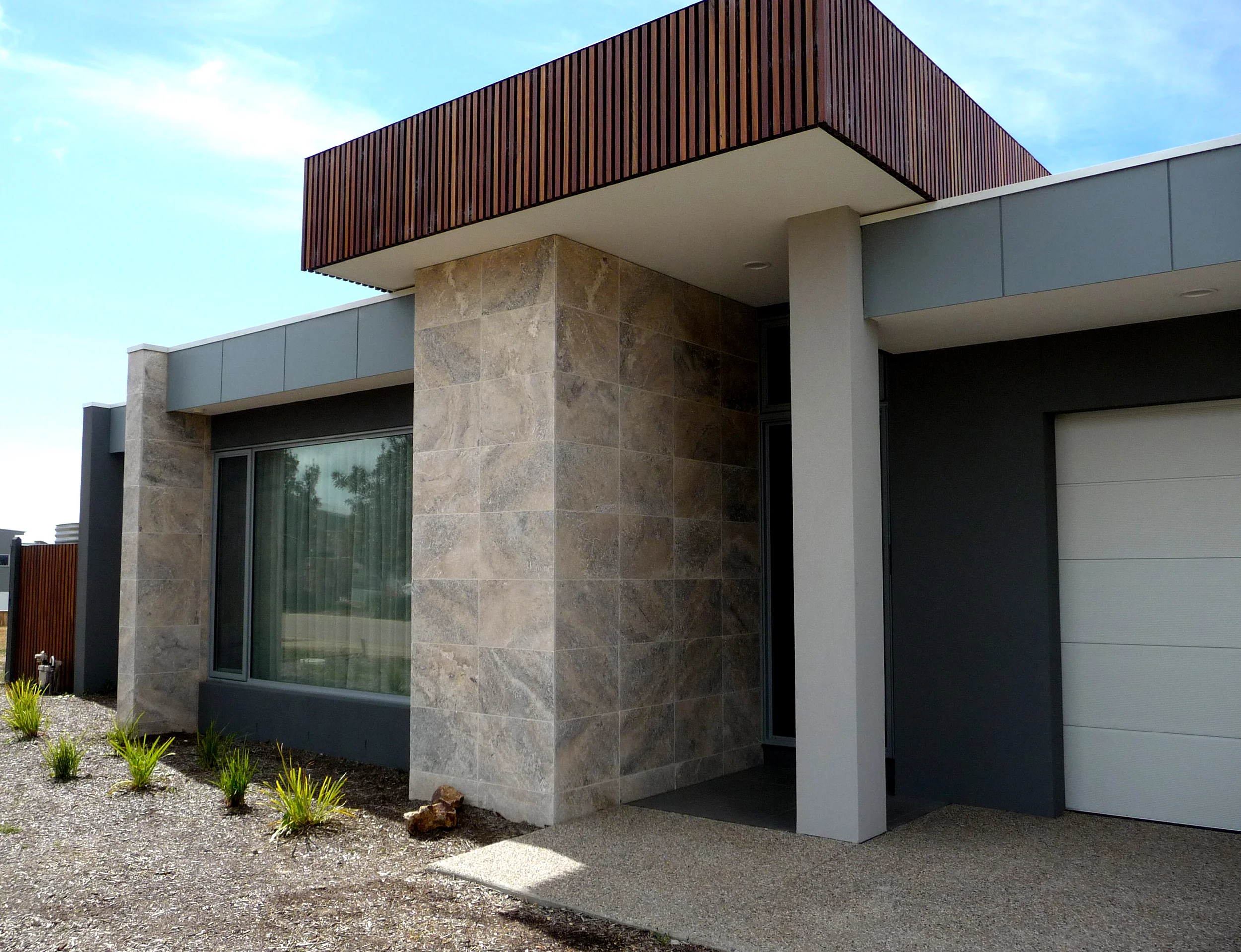 Silver Unfilled Travertine on House Facade