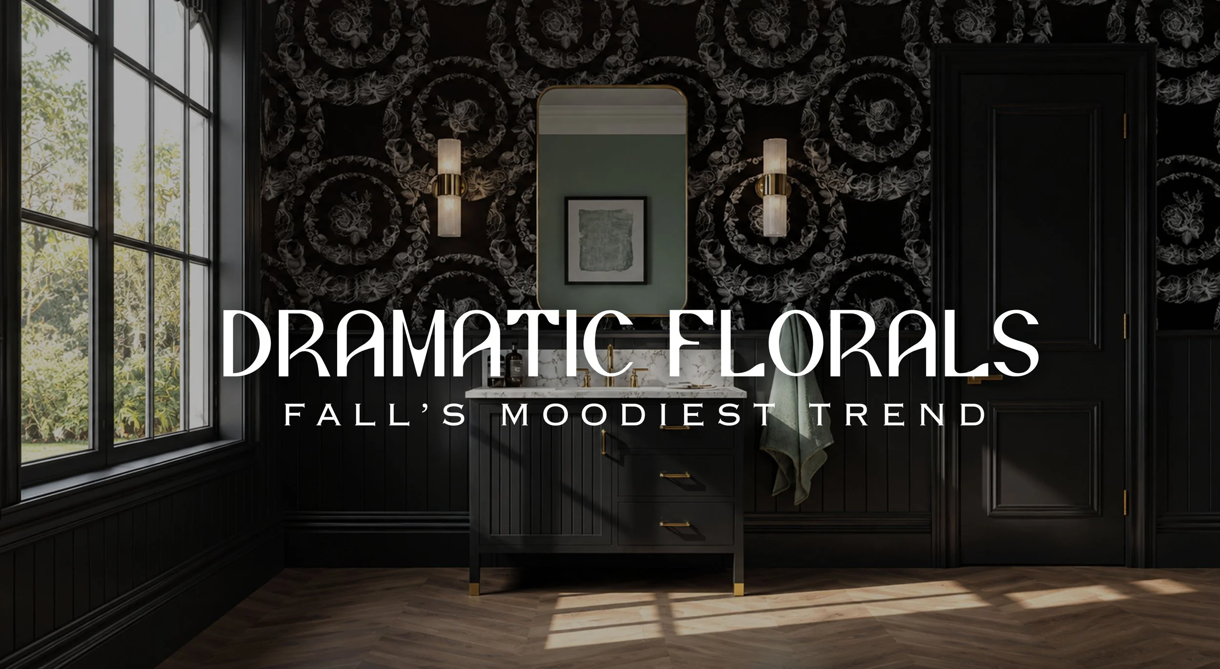  Moody powder room featuring dramatic black floral wallpaper, black vanity with brass accents, marble countertop, oversized mirror, warm sconces, and natural light from a large window. Text overlay reads “Dramatic Florals — Fall’s Moodiest Trend.”