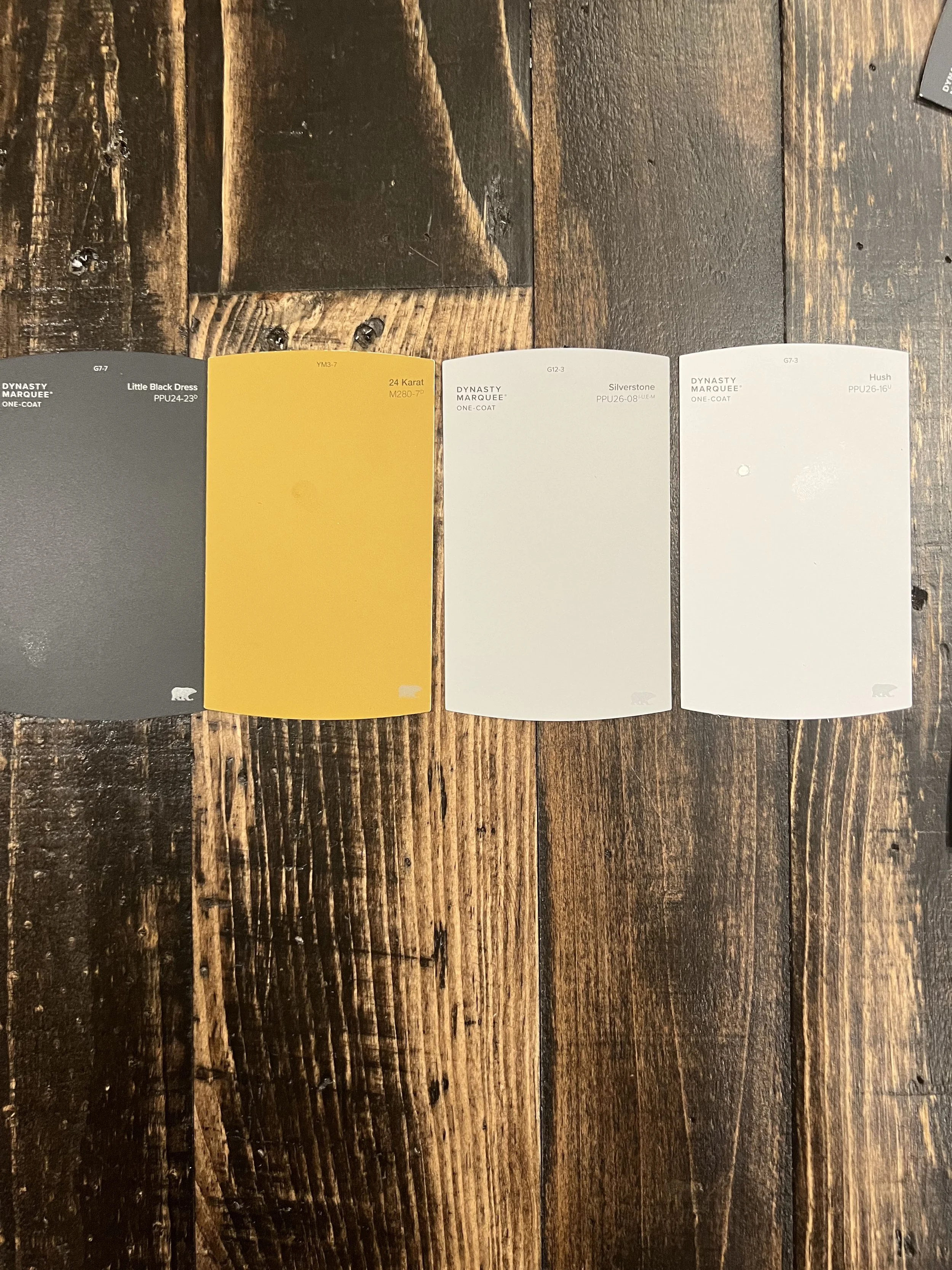 KC G.I.F.T. design palette with neutral colors and warm wood-inspired tones.