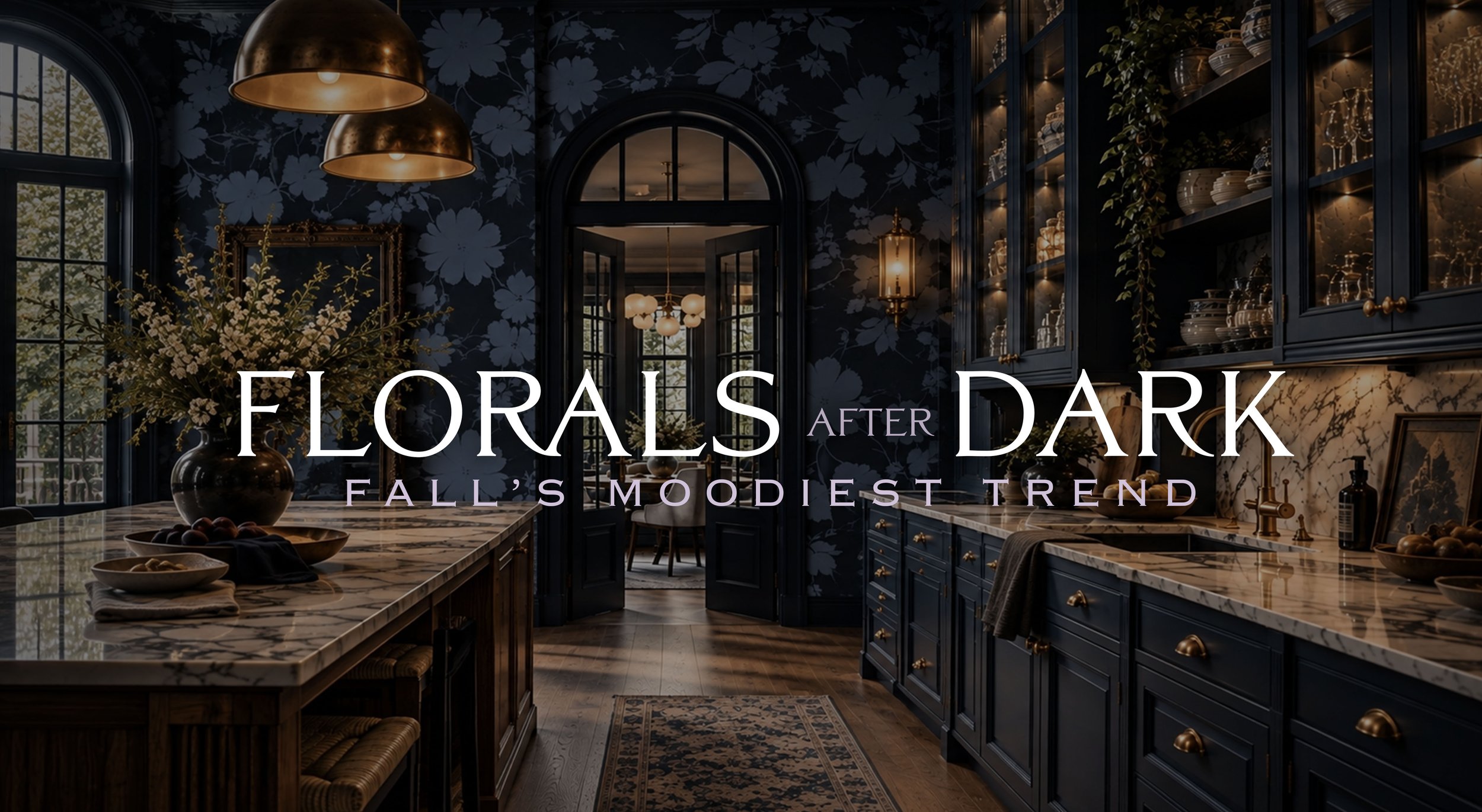  Luxurious, moody kitchen featuring dramatic navy blue floral wallpaper, deep blue cabinetry, marble countertops, warm brass fixtures, and an elegant arched doorway. A sophisticated take on fall’s moody floral wallpaper trend by Complex Flavors Home 