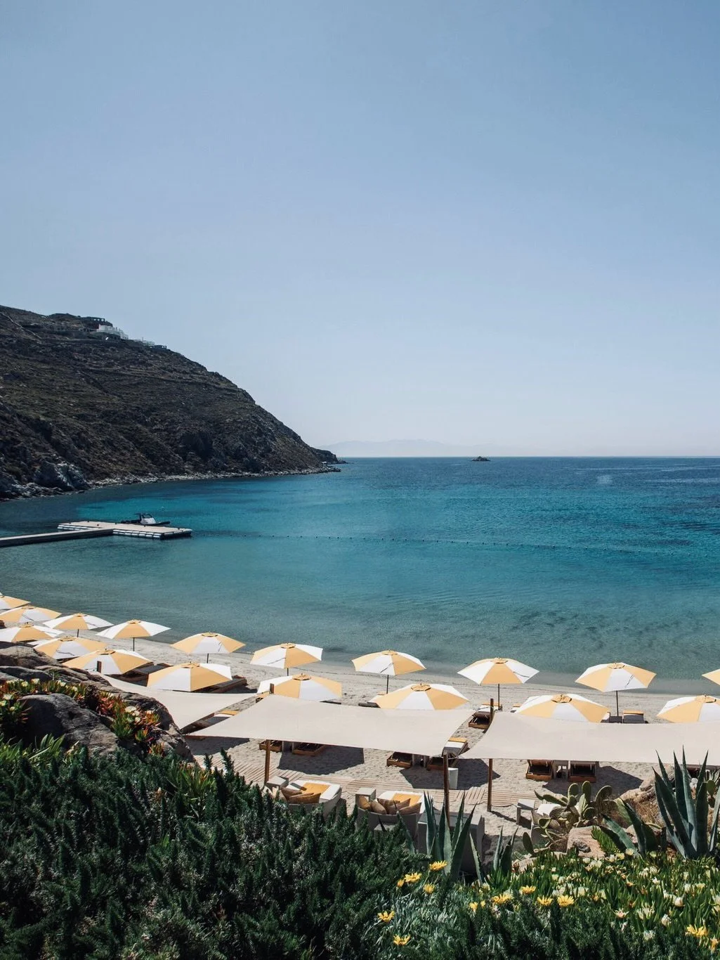 Santa Marina (@santamarinamykonos) has been part of Mykonos for long enough to feel like the island itself.
Perched on its own private peninsula above Ornos Bay &mdash; the only true private beach on Mykonos &mdash; the hotel carries the energy of th
