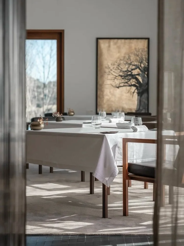 L&rsquo;AND Vineyards (@landvineyards) sits in the Alentejo plain outside Montemor-o-Novo, an hour from Lisbon and a different world entirely. The architecture &mdash; by M&aacute;rcio Kogan &mdash; keeps the property low and horizontal against the l
