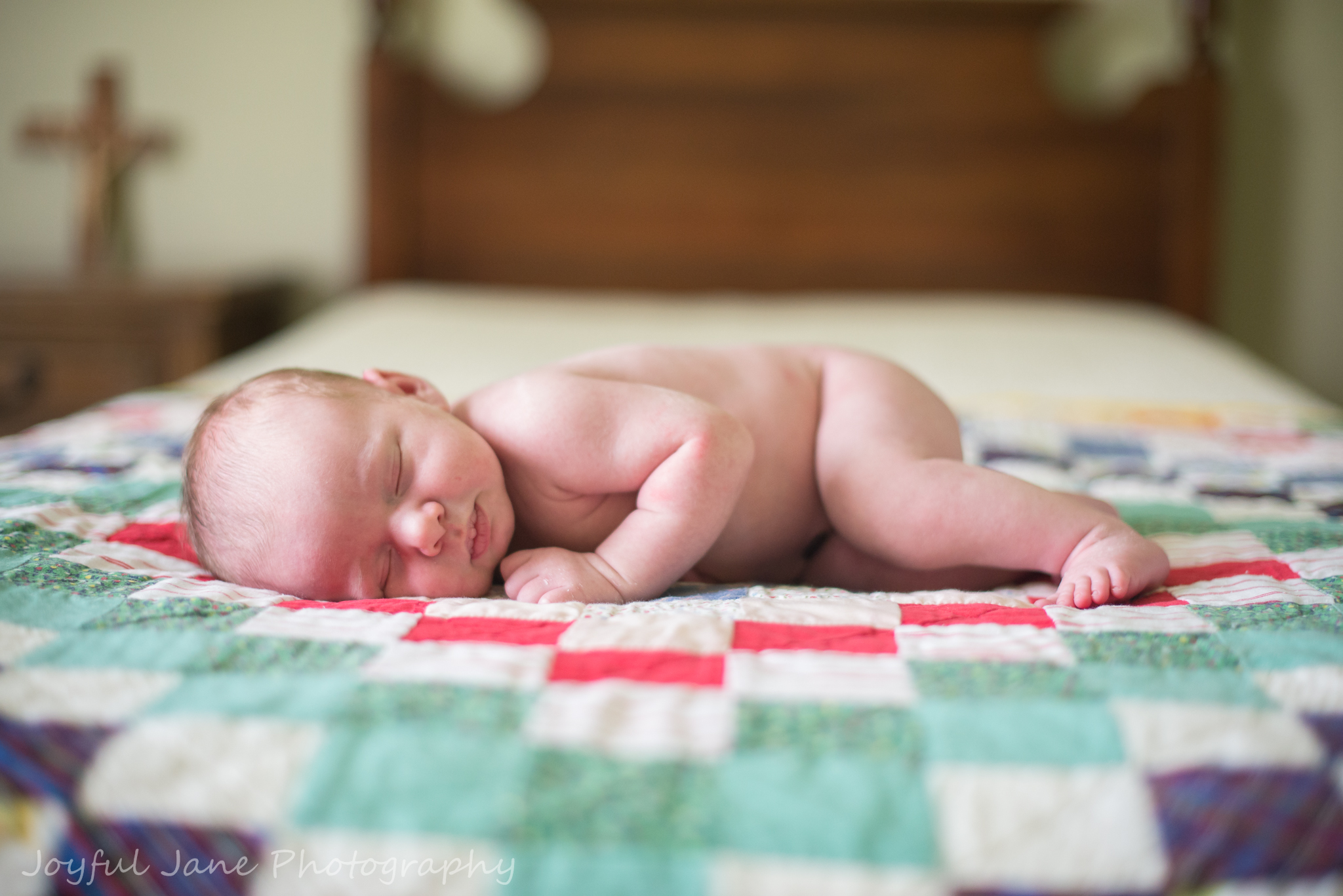 baby sleeping on bed