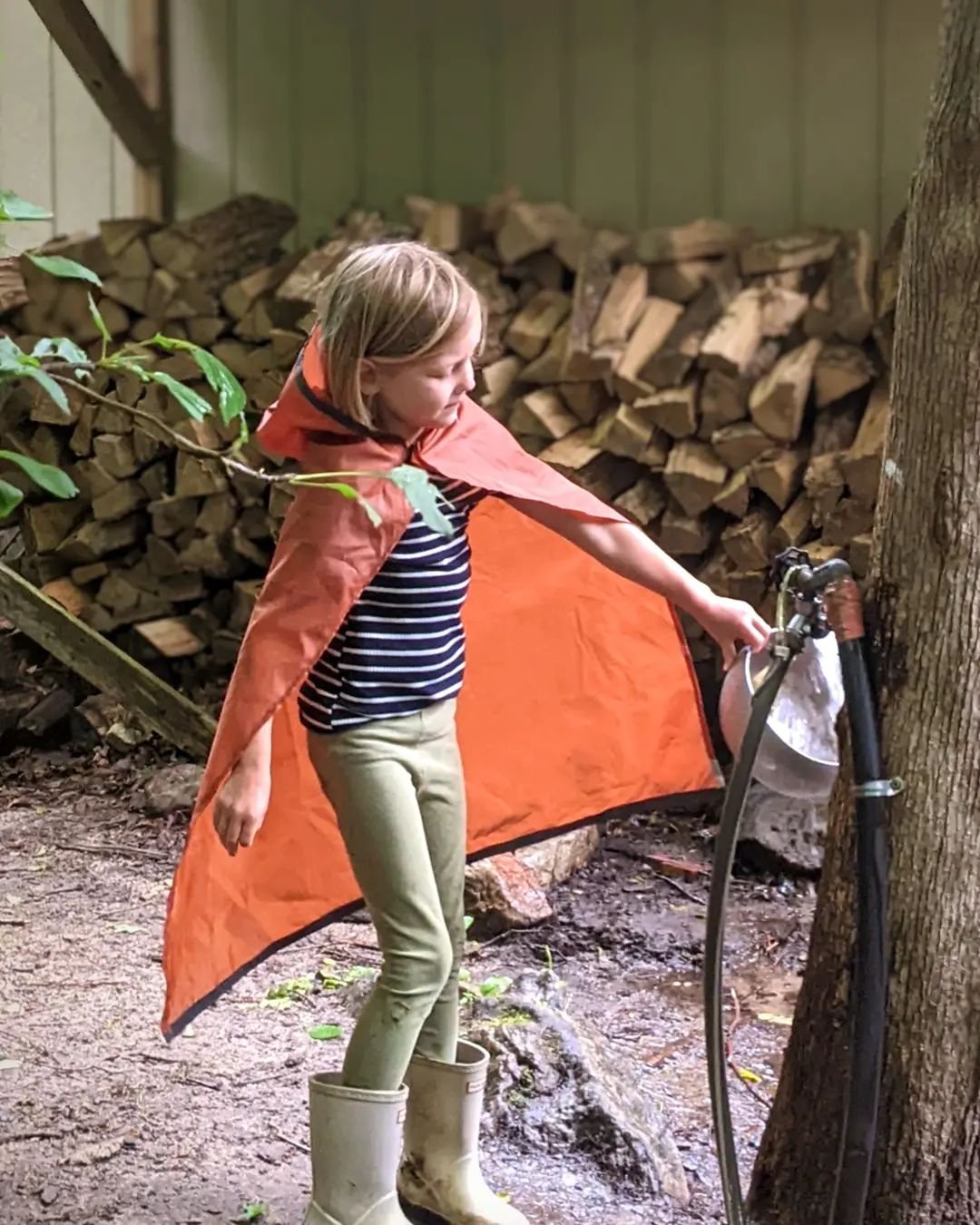 rain poncho 
made from waterproof fabric from a broken tent 
for this rainy day at forest camp