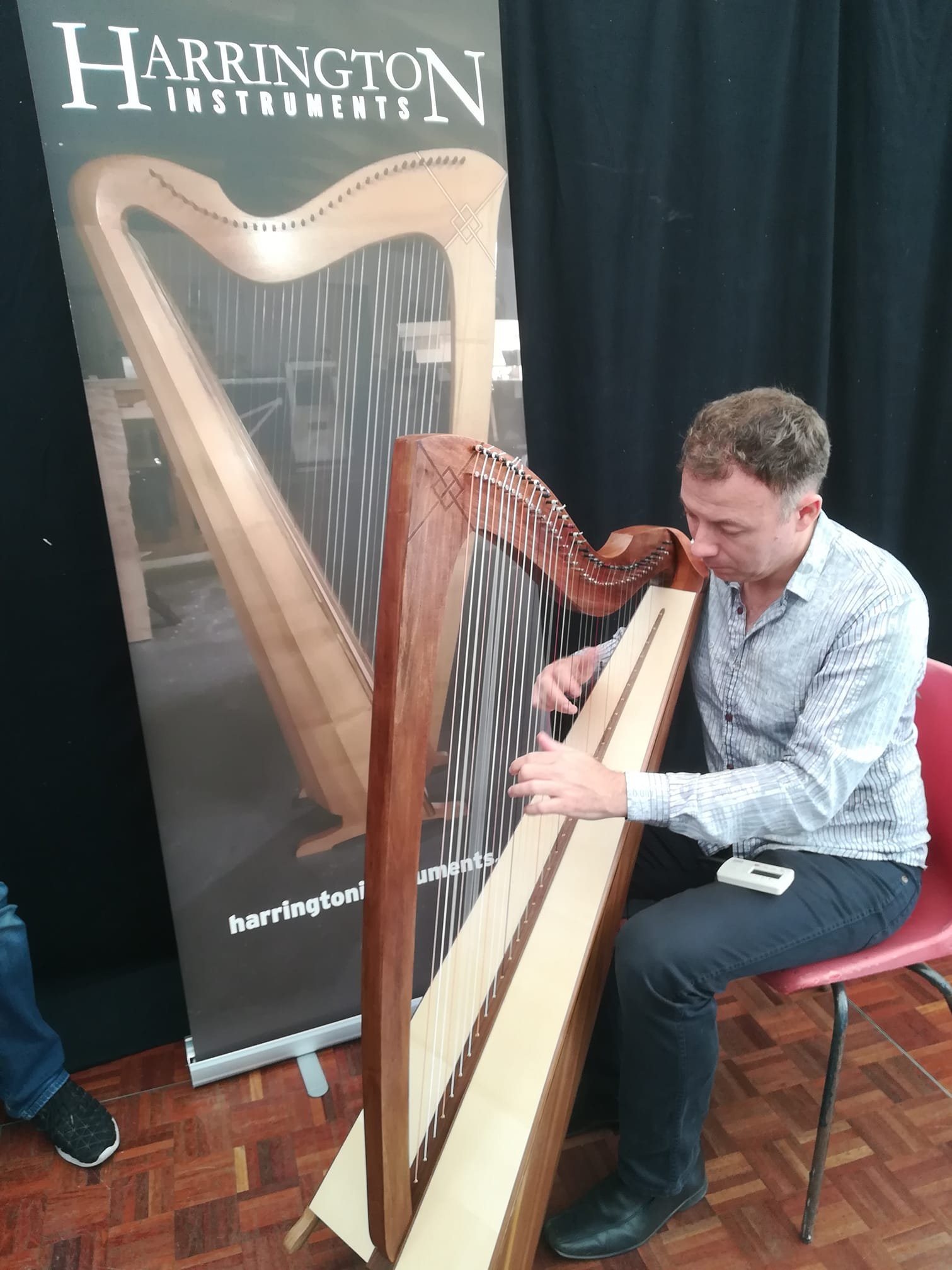 The Great De Barra bringing one of the harps for a dance today at the Willie Clancy Summer School in Milltown Malbay