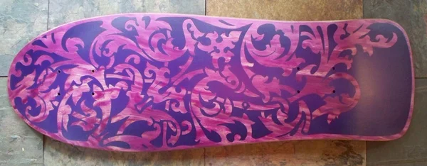 Customize a skateboard with tape stencil