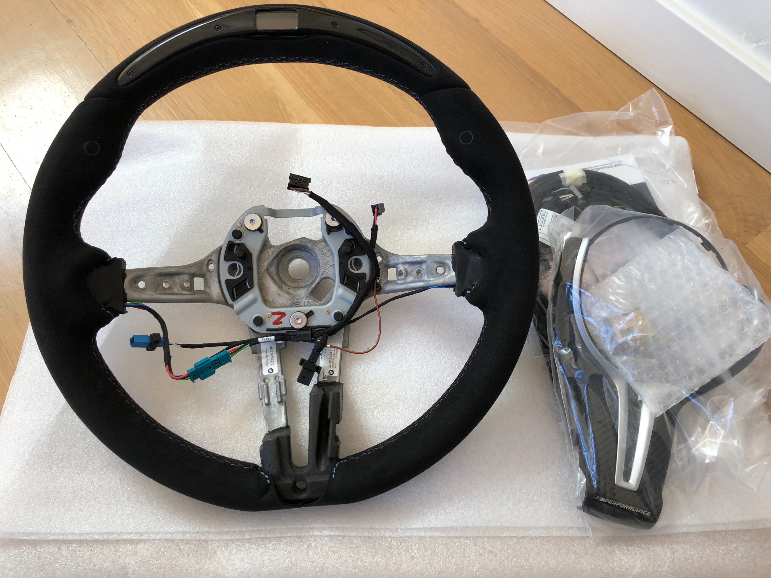 M Performance racing steering wheel with display
