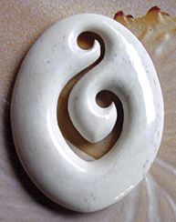A double koru bone carving