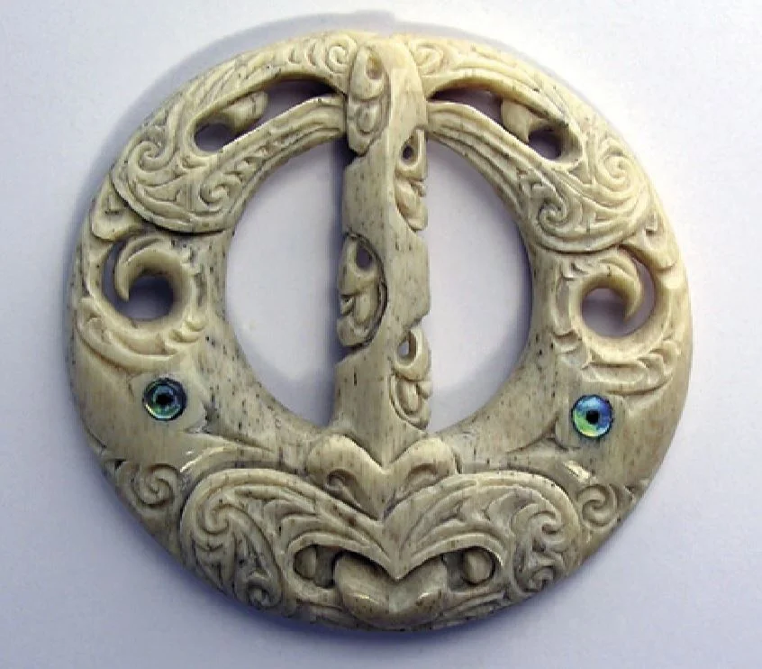 This carving representing flax is made from the jawbone of Tahi, a sperm whale