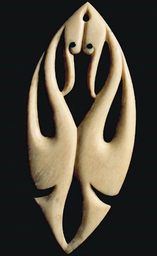 Carving of a pair of kōtuku greeting each other