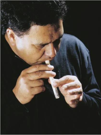 The late Dr Hirini Melbourne playing a bone koauau