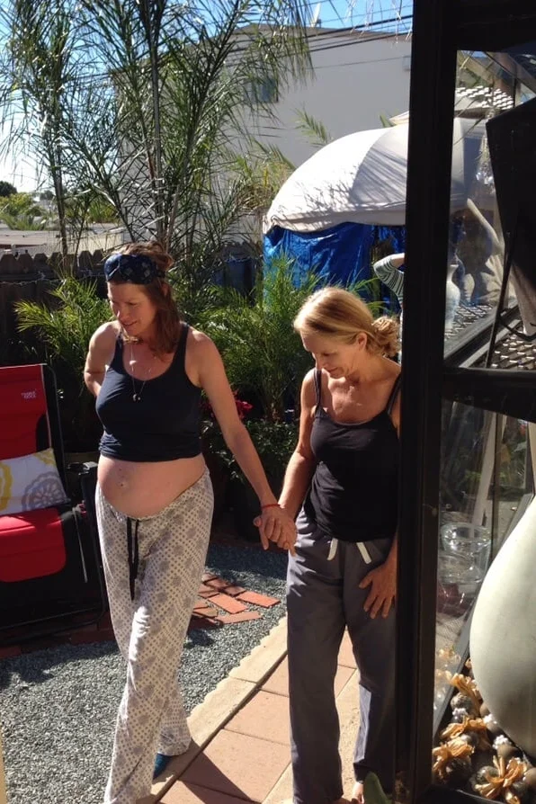 "Here's the bottom line: Paula was put on this earth to bring babies into this world and empower women through the birthing process!...What Paula gives to her clients is so far above and beyond the level of excellence, it's hard to believe one human being can give so much." An excerpt from a Yelp testimonial from one of Paula's clients shows just how grateful and adored a midwife is by the mothers who receive their care. Pictured above is that woman with Paula by her side, holding hands while she is in labor. 