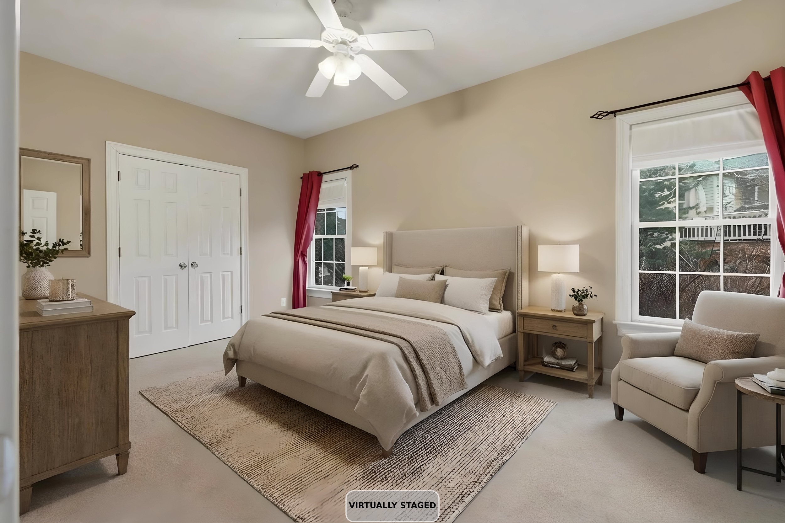 A bedroom with a queen size bed, bedside tables with lamps, a window with red curtains, a ceiling fan, and natural light coming in. It appears clean and has a neutral color scheme.