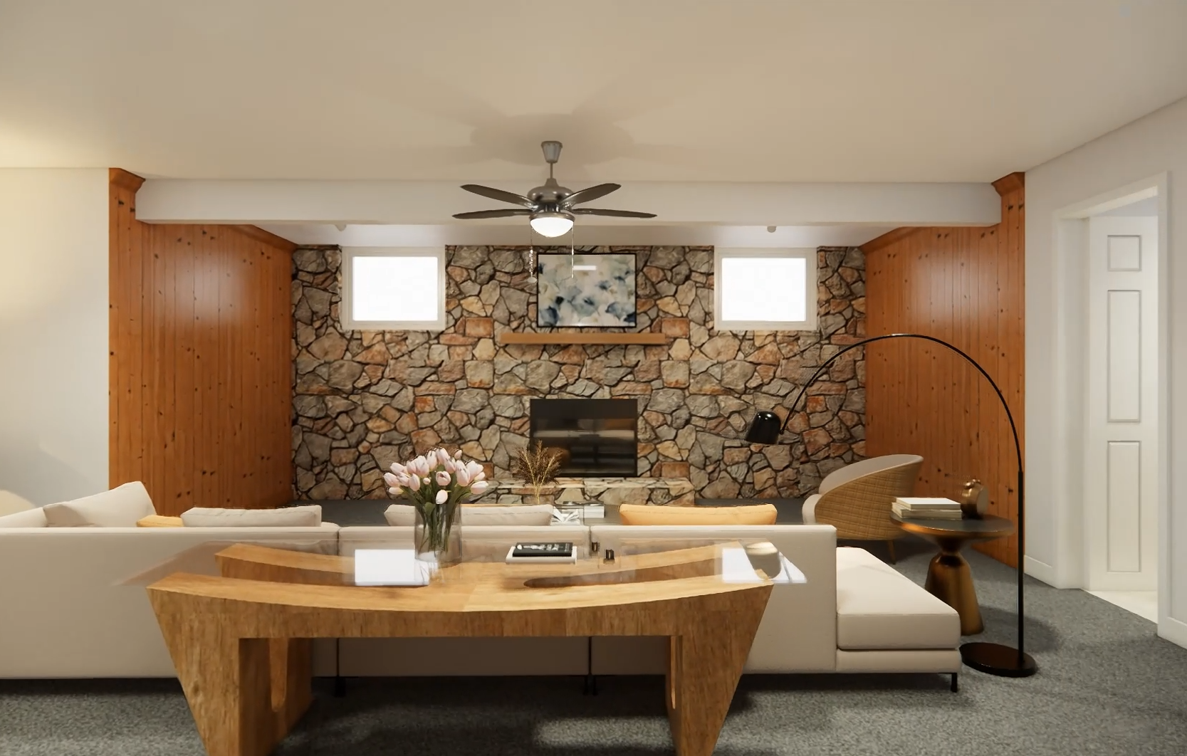 Cozy living room with stone fireplace, wooden panel walls, and furniture including a beige sofa, wooden desk, flower vase, and floor lamp.