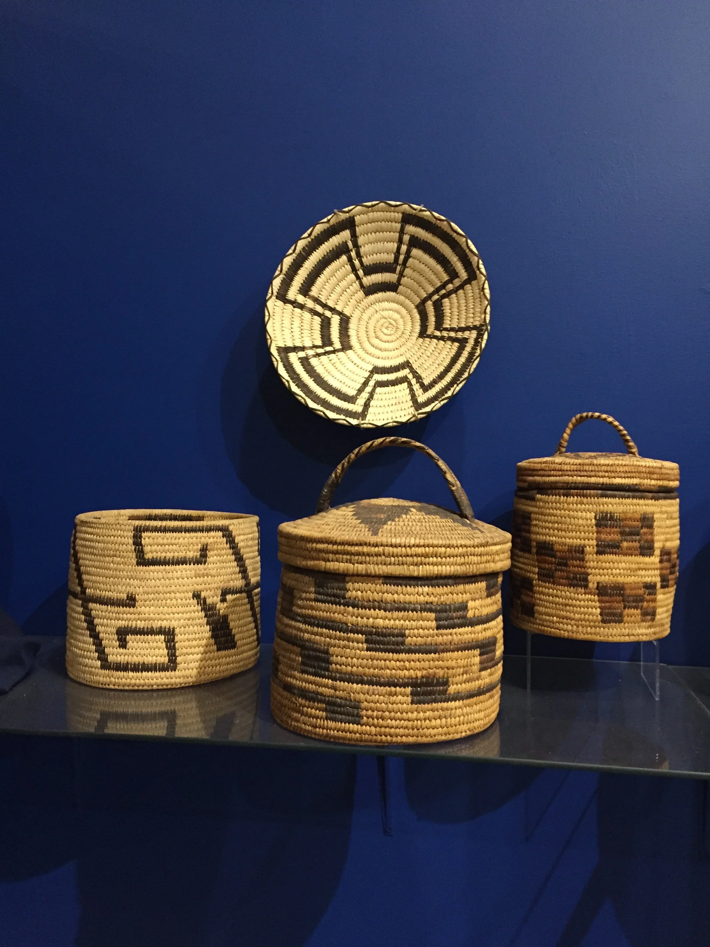 Traditional Native American baskets displayed in a museum exhibit