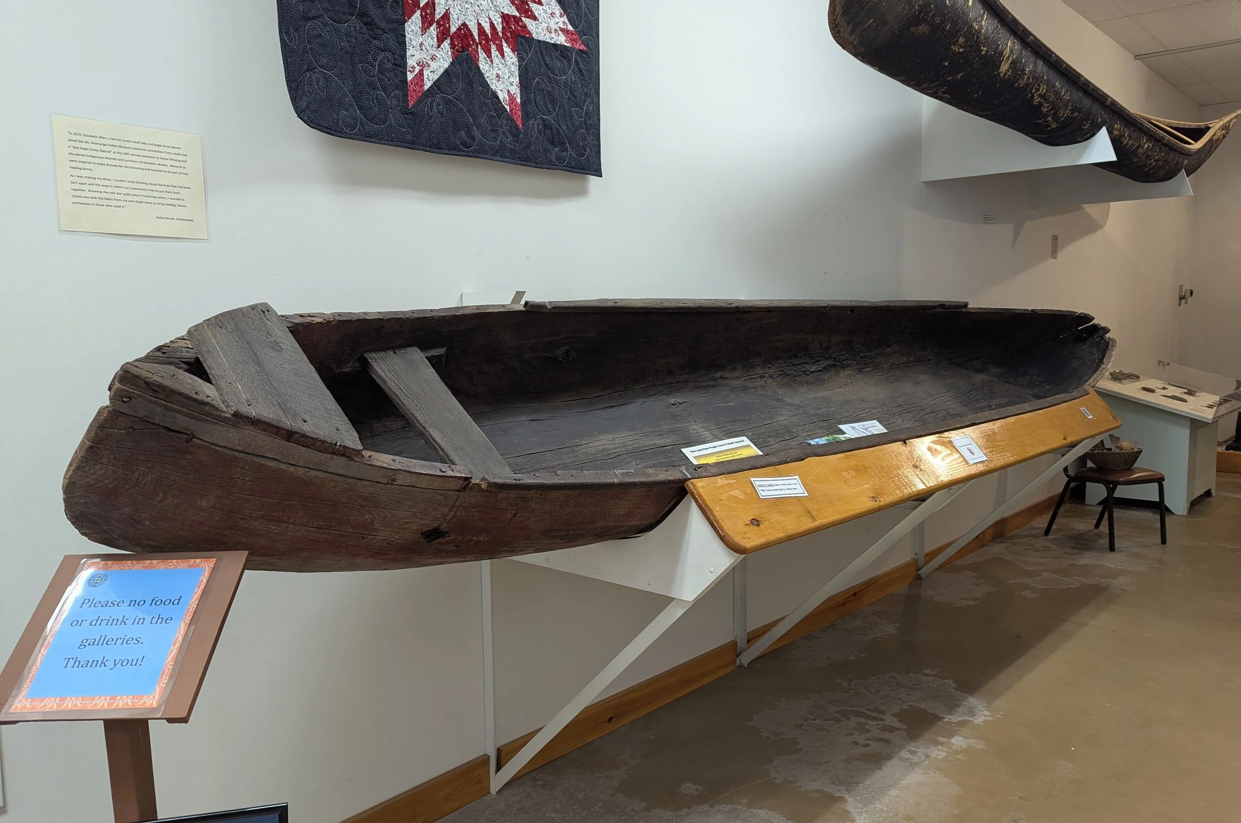 Traditional Native canoe displayed in a museum exhibit