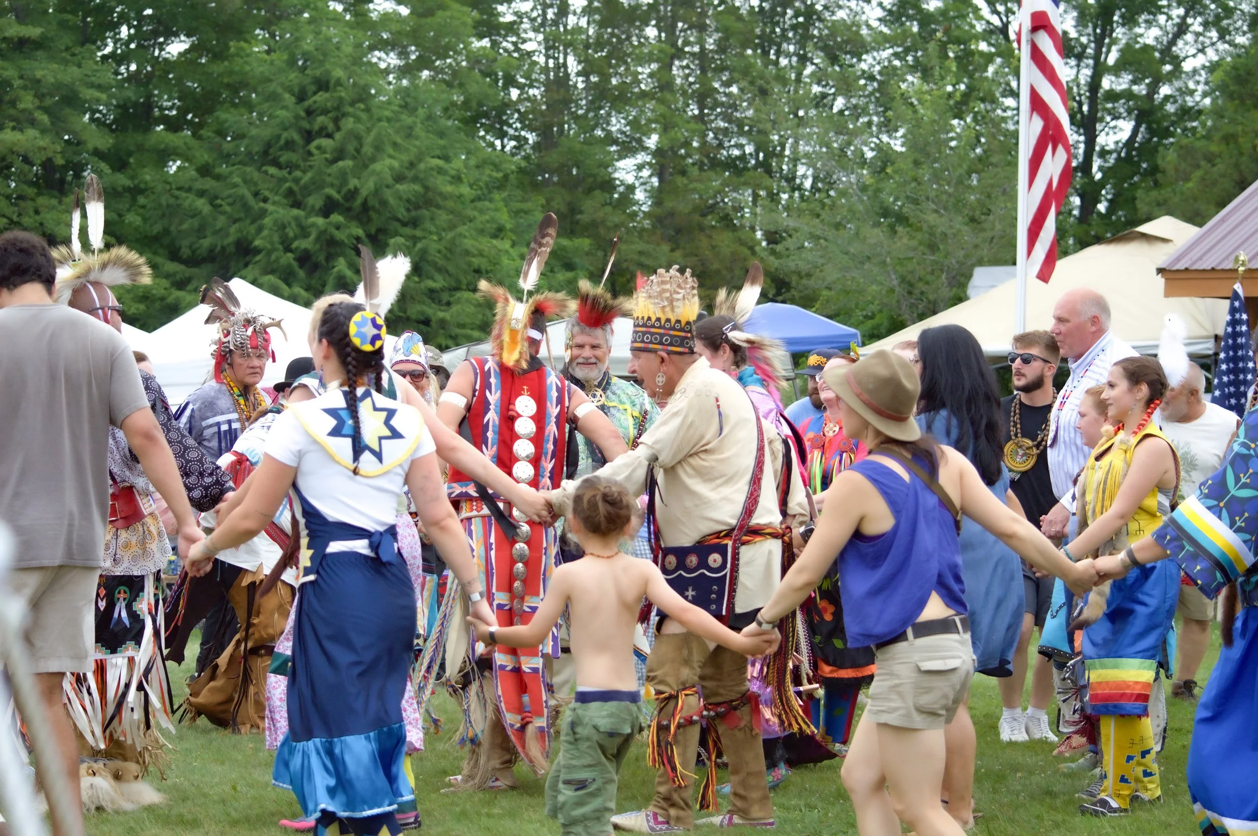 People of all ages participating in a Native American powwow at Mt. Kearsarge Indian Museum in New Hampshire
