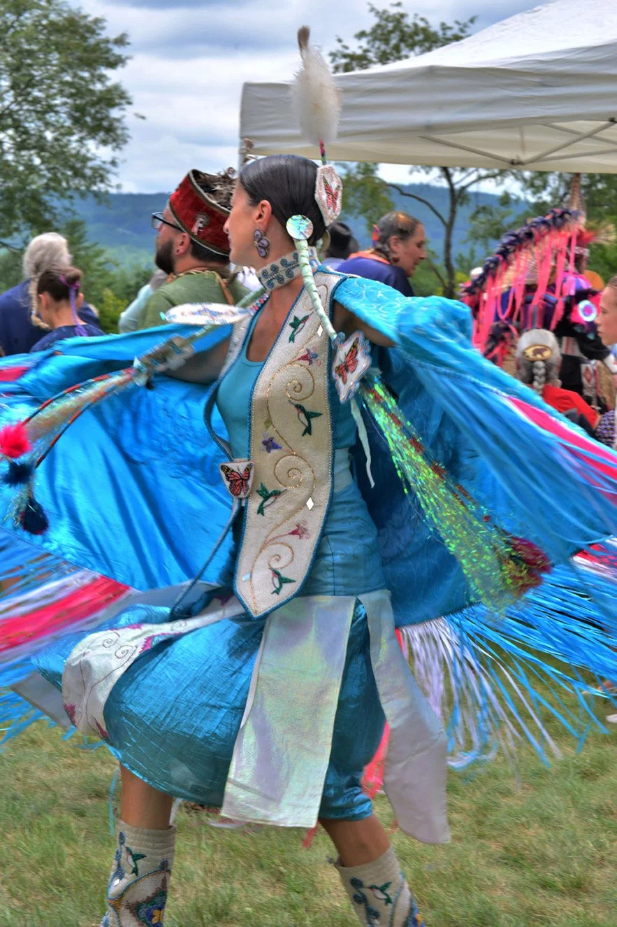 Native American dancer in blue traditional dress at cultural event at Mt. Kearsarge Indian Museum