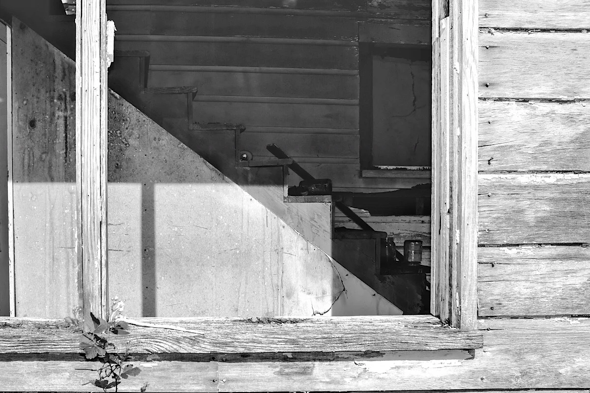 The Backstairs , in black and white, with more emphasis on the texture in the wood.