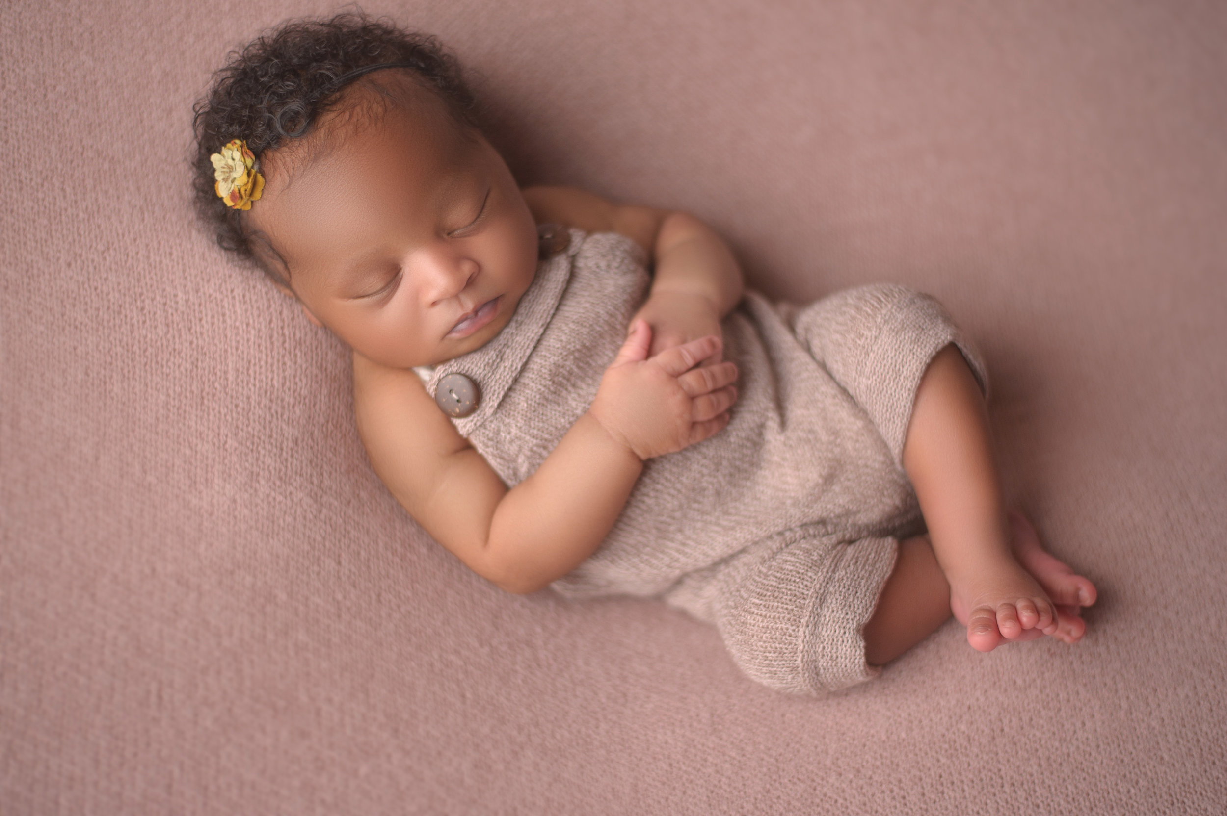 Newborn baby nestled in a soft, cozy blanket