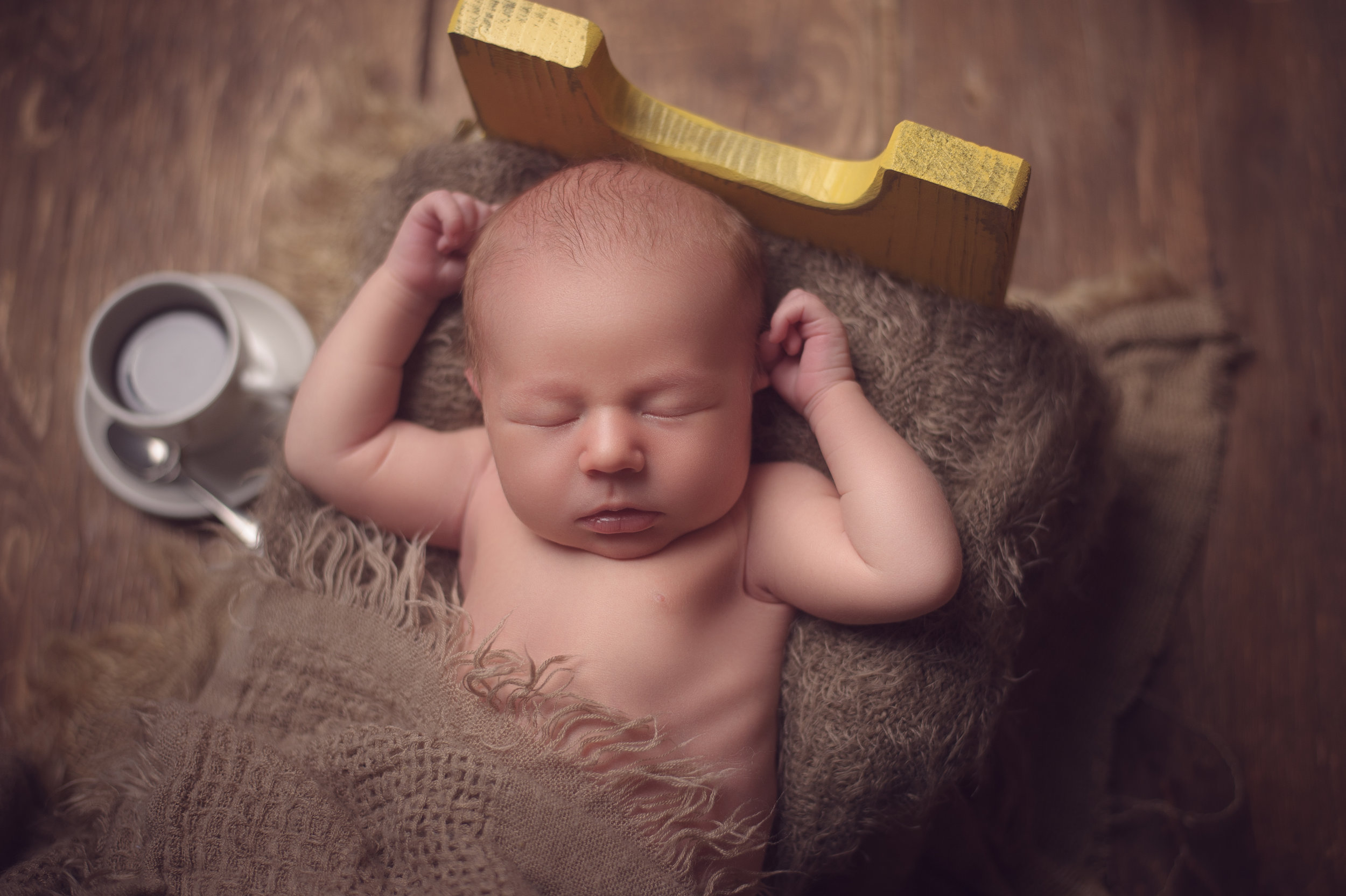 Newborn baby wrapped in a knitted cocoon