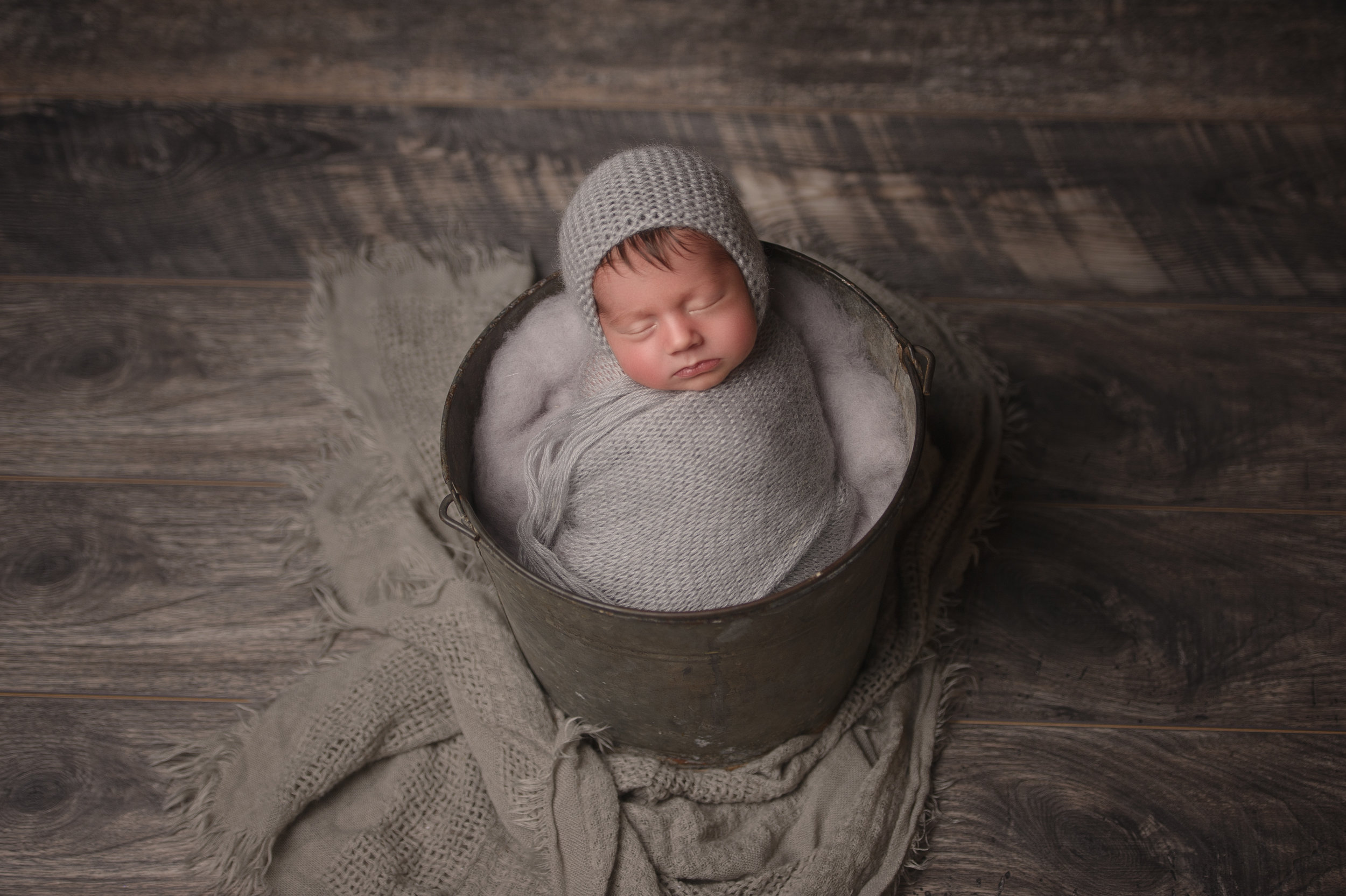 Newborn baby wrapped in a soft blanket