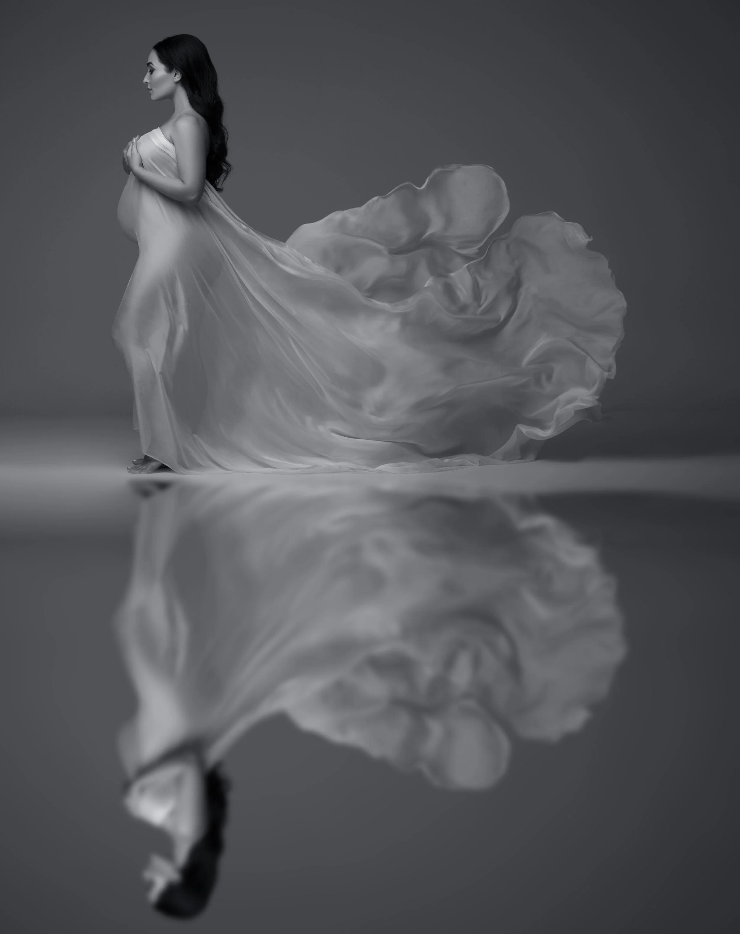 Maternity indoor photoshoot: Expectant mother poses like a princess