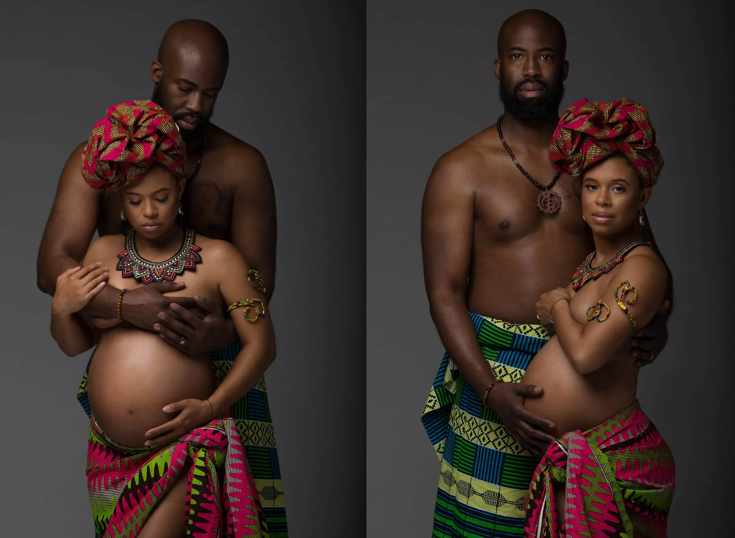 A man with a shaved head and beard and a young girl with a headwrap and traditional jewelry pose together against a gray background. The man is shirtless and holding the girl, who is wearing a colorful sarong and jewelry.