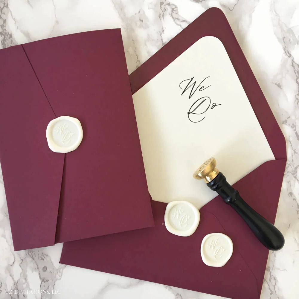 burgundy and gold glitter pocket invitation with wax seal