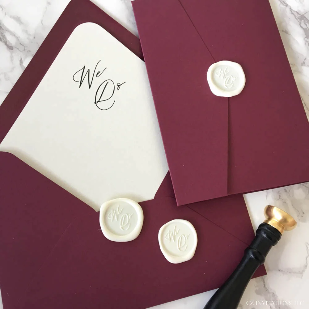 burgundy and gold glitter pocket invitation with wax seal
