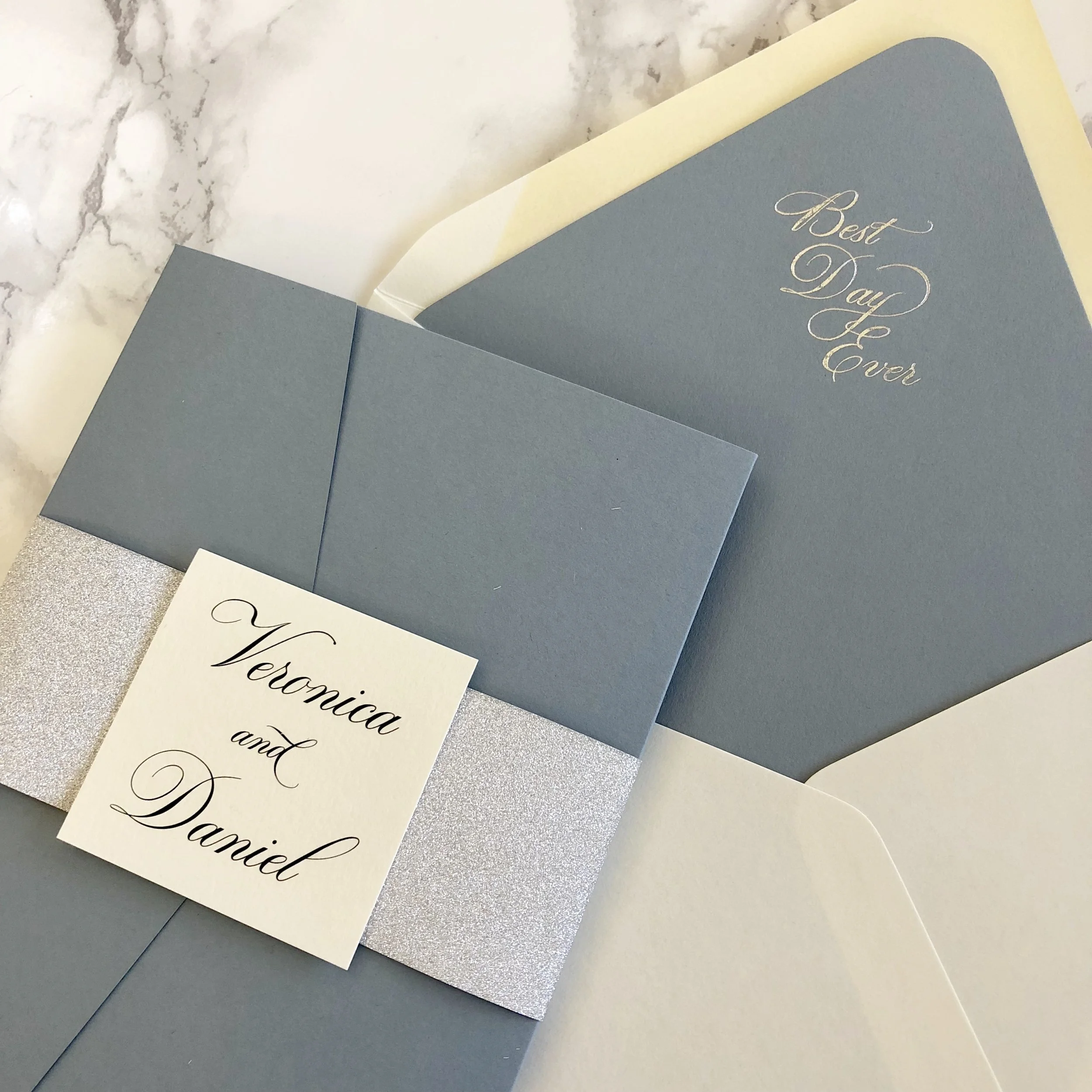 silver foil stamped dusty blue invitation