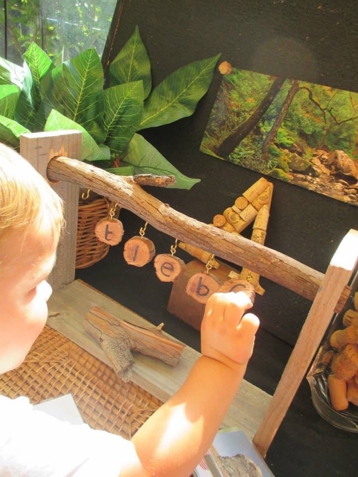 boy with natural materials and letters.jpg