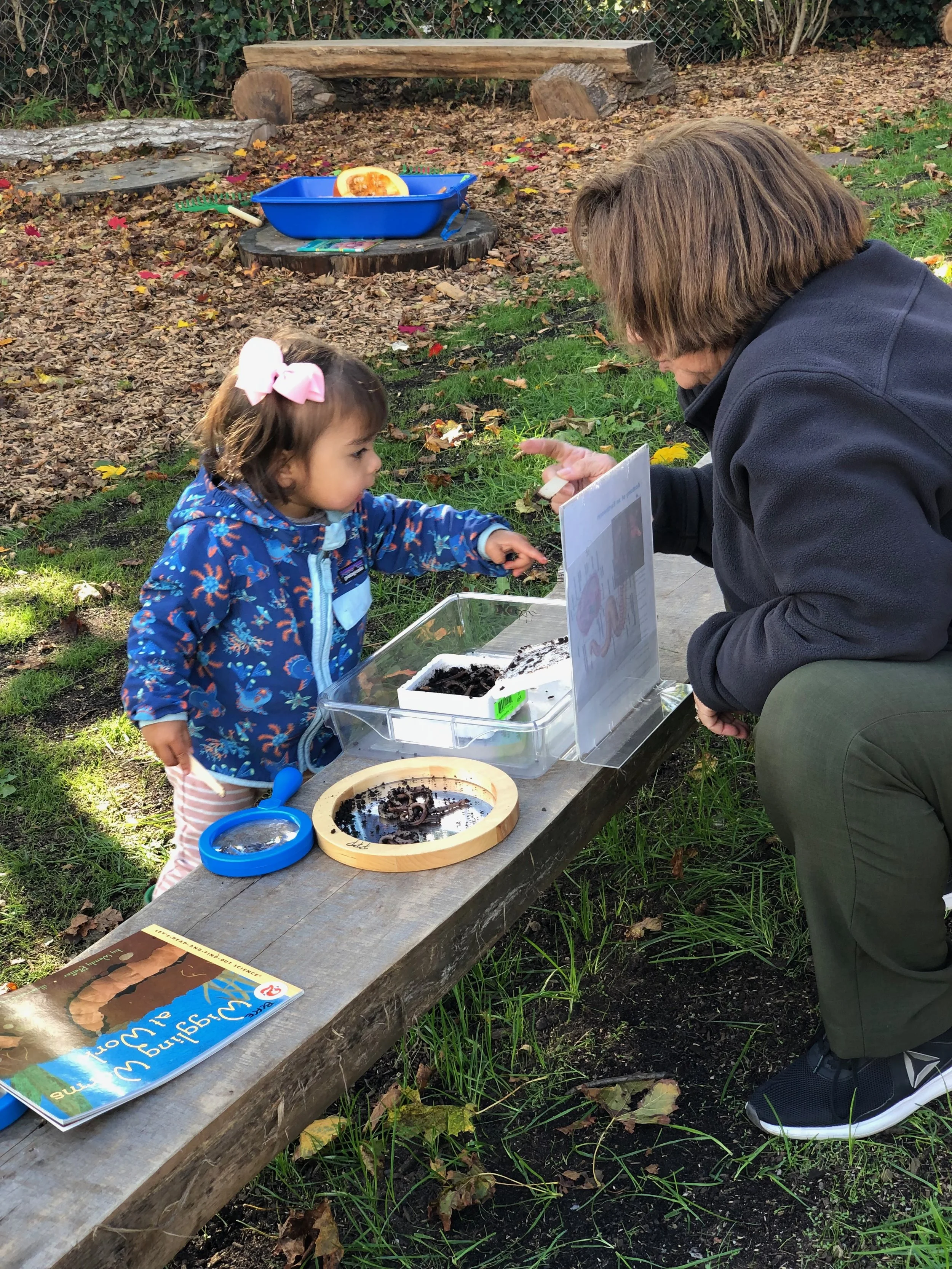 Girl pointing to worm picture with Mary 2.jpeg