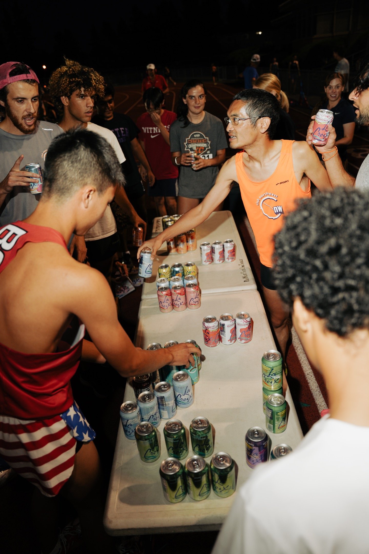 Competitors carefully aligning their cans