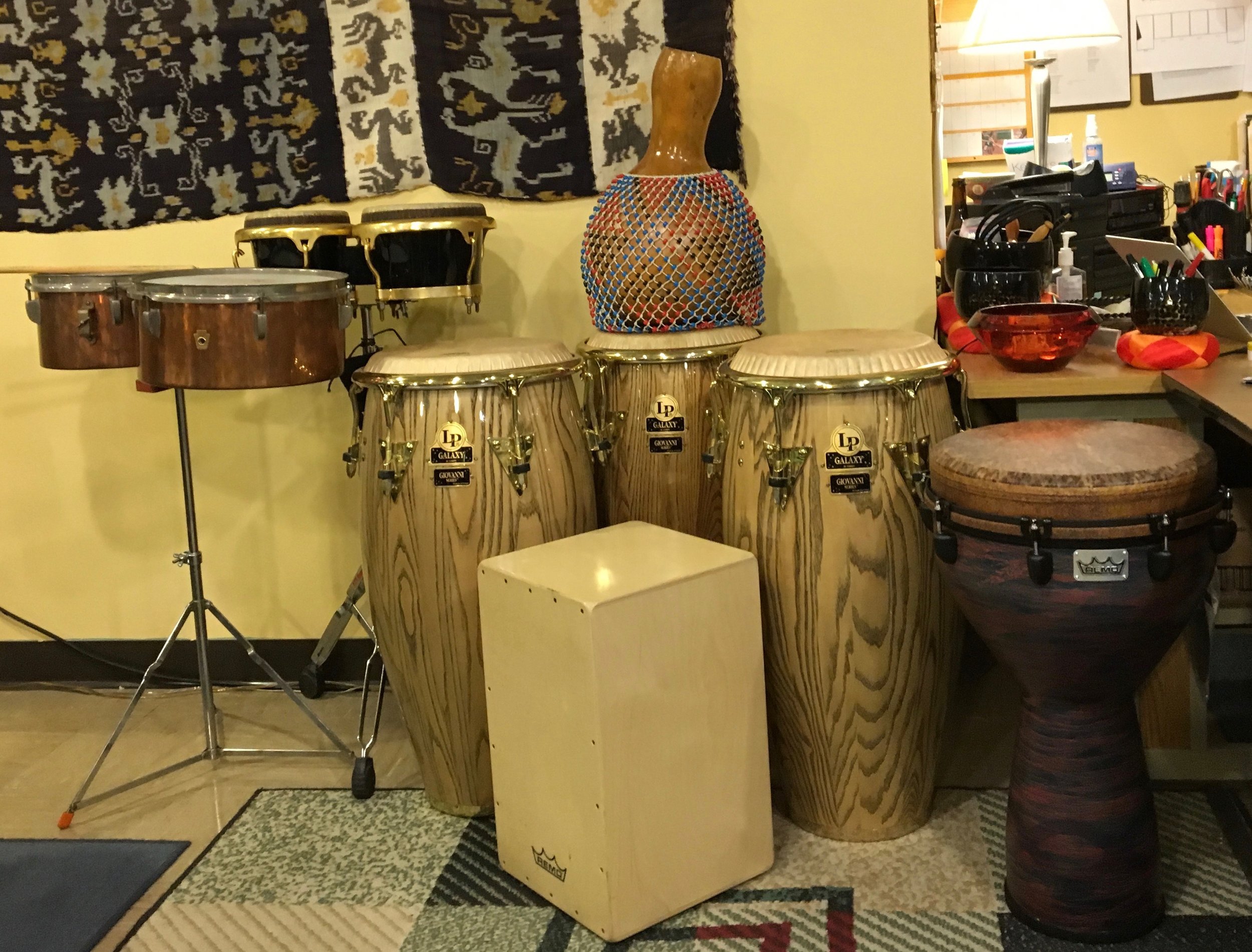 Latin Percussion (L to R): WFL vintage copper timbales, Toca Bongos, LP Giovanni Hidalgo Signature Series Congas, Remo Peruvian Cahon, hand-made shekere, Remo Djembe