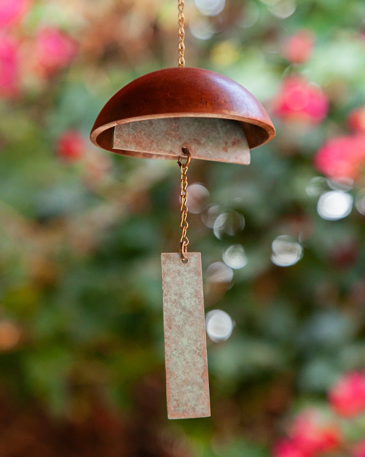 Our medium handcrafted, one-of-a-kind, artistic metal wind chimes are a perfect addition to your home or garden! Unlike many ceramic bells, our metal wind chimes easily make sound with the movement of the wind.
Each chime is carefully patina'd and s