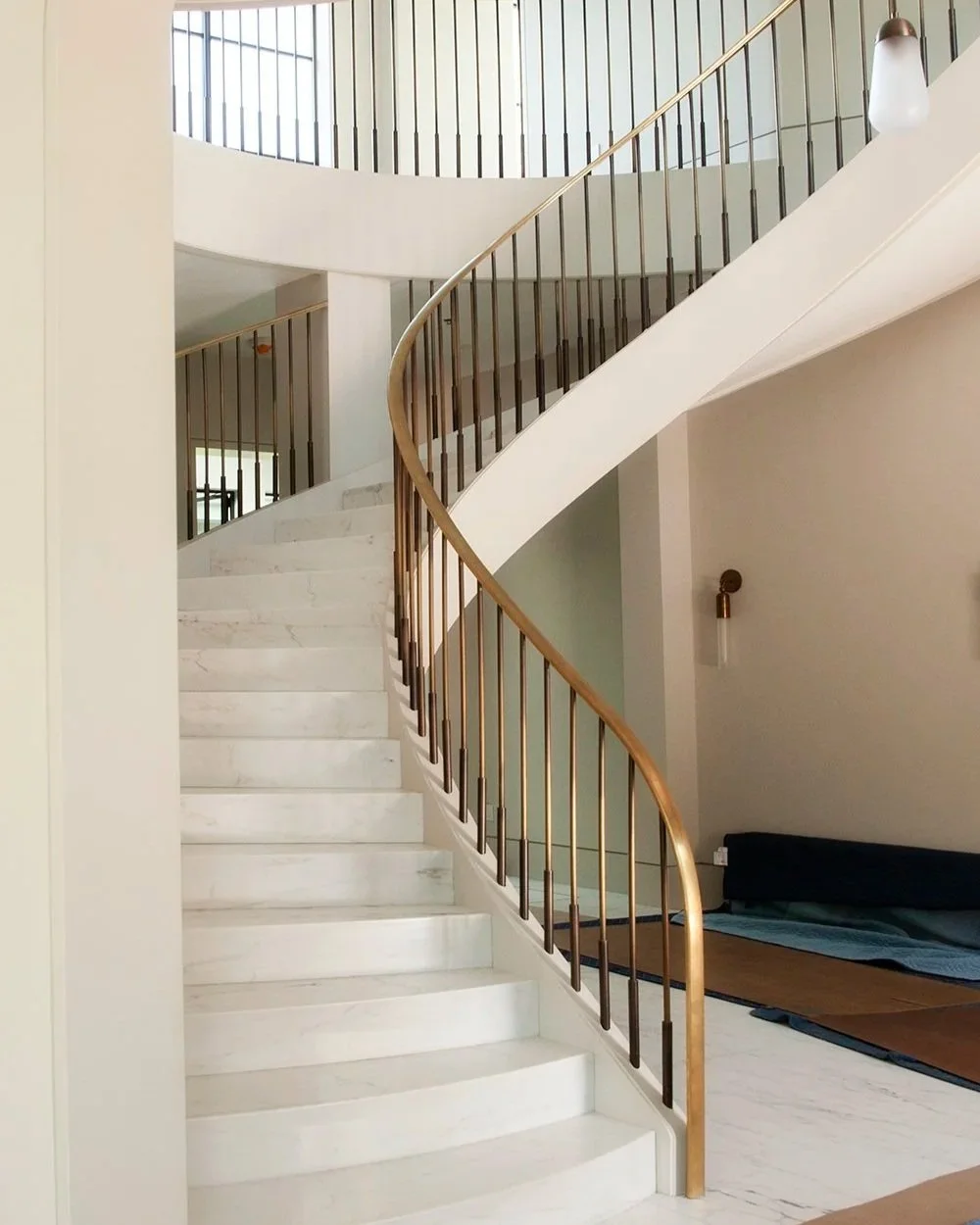  Patina’d brass spiral staircase for interior designer Judith Lance 