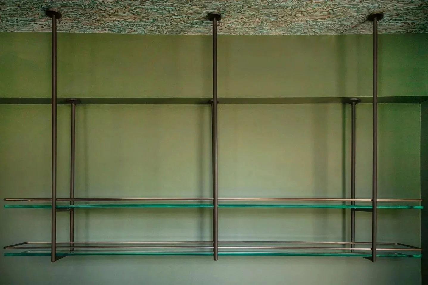  Patina’d brass bar shelf for interior design studio Studio Keeta 