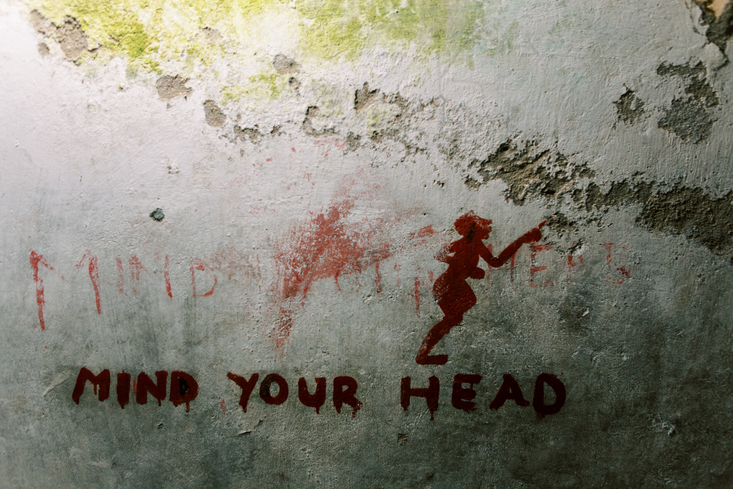  A sign reminding visitors to ‘mind your head’ as the ceilings in the slave chambers  are unexpectedly low. 