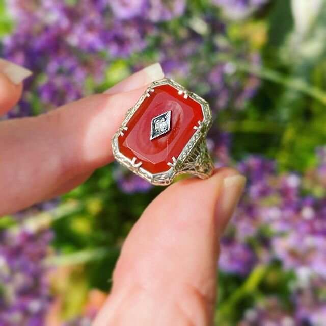 Art Deco Era Carnelian concave plaque with old cut center diamond. Incredible detailed openwork that is in wonderful shape, and so so intricate. Look even at the details of the prongs around the carnelian! 14k white gold, and nice substantial size. I