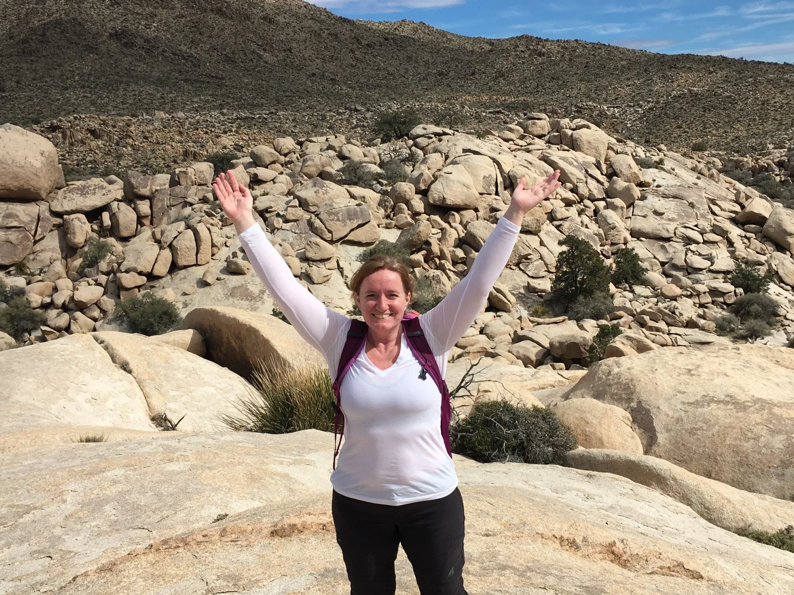Facing my fear of heights to scramble up a 450 feet high rock pile in Joshua Tree leaves me feeling grateful for the whole world.