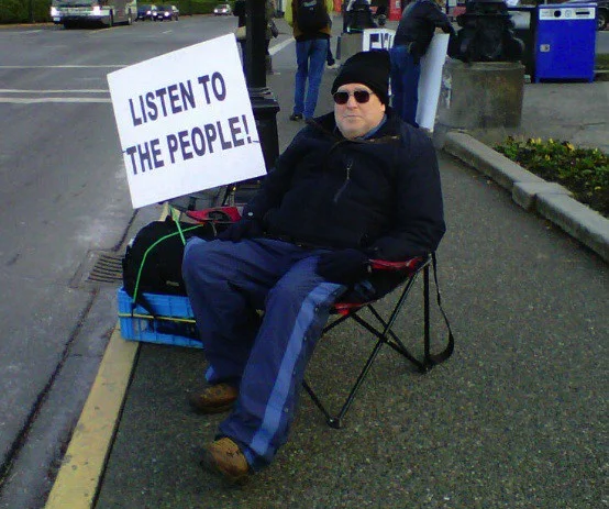 A picture I took of a protestor (with his permission) who set up camp outside the B.C. legislature week after week to protest tax changes.