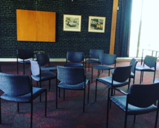 A circle of chairs waiting for the conversation to begin.