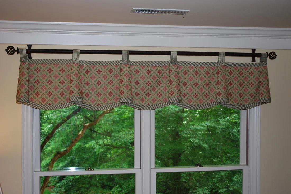 Scallop valance with bells mounted on wrought iron hardware for Catherine King Interiors
