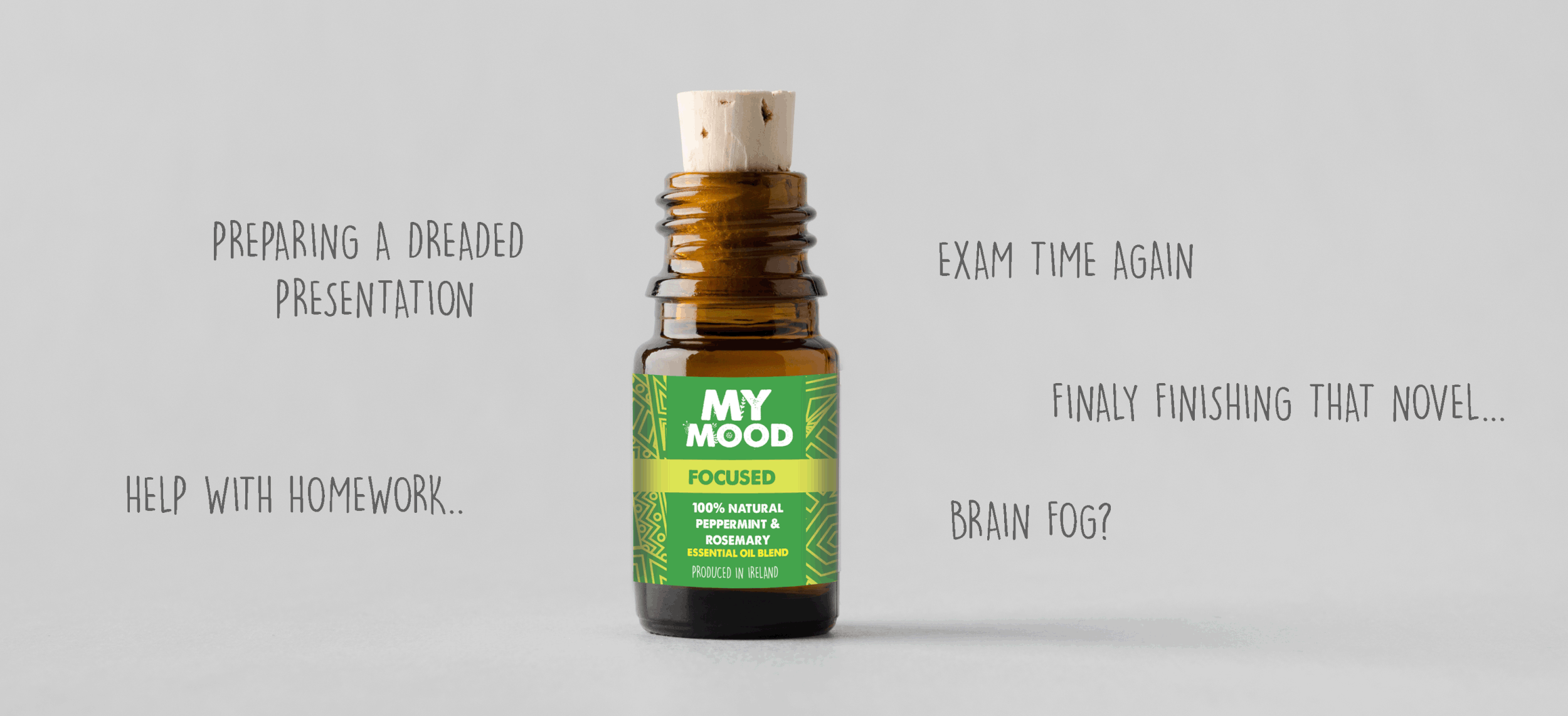 A small brown bottle labeled 'My Mood Focused,' a 100% natural peppermint and rosemary essential oil blend, is displayed. Accompanying text suggests uses for mental tasks like preparing presentations, exams, homework, finishing a novel, and combating