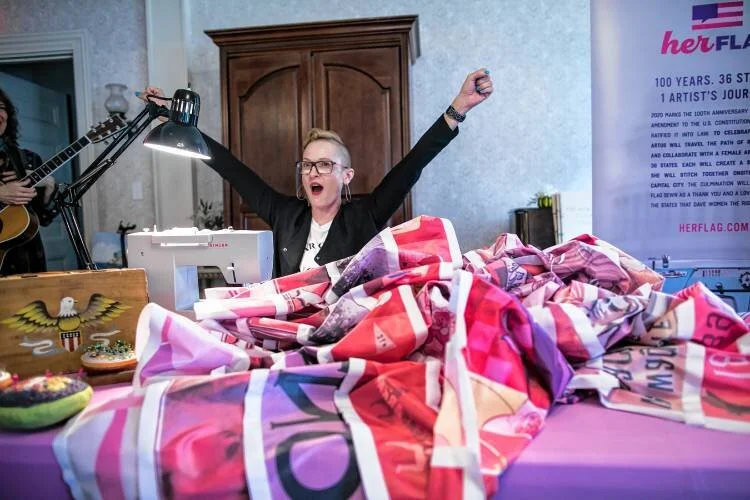  Marilyn Artus celebrates after attaching the New Hampshire portion of Her Flag at the Woman’s Club in Concord on Saturday. GEOFF FORESTER / Monitor staff 