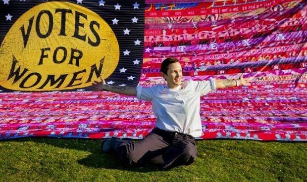   Oklahoma artist Marilyn Artus displays her completed multi-year collaborative project "Her Flag," which commemorates the 100th anniversary of the 19th Amendment, at Scissortail Park in Oklahoma City, Okla. on Friday, Aug. 21, 2020. The completed fl