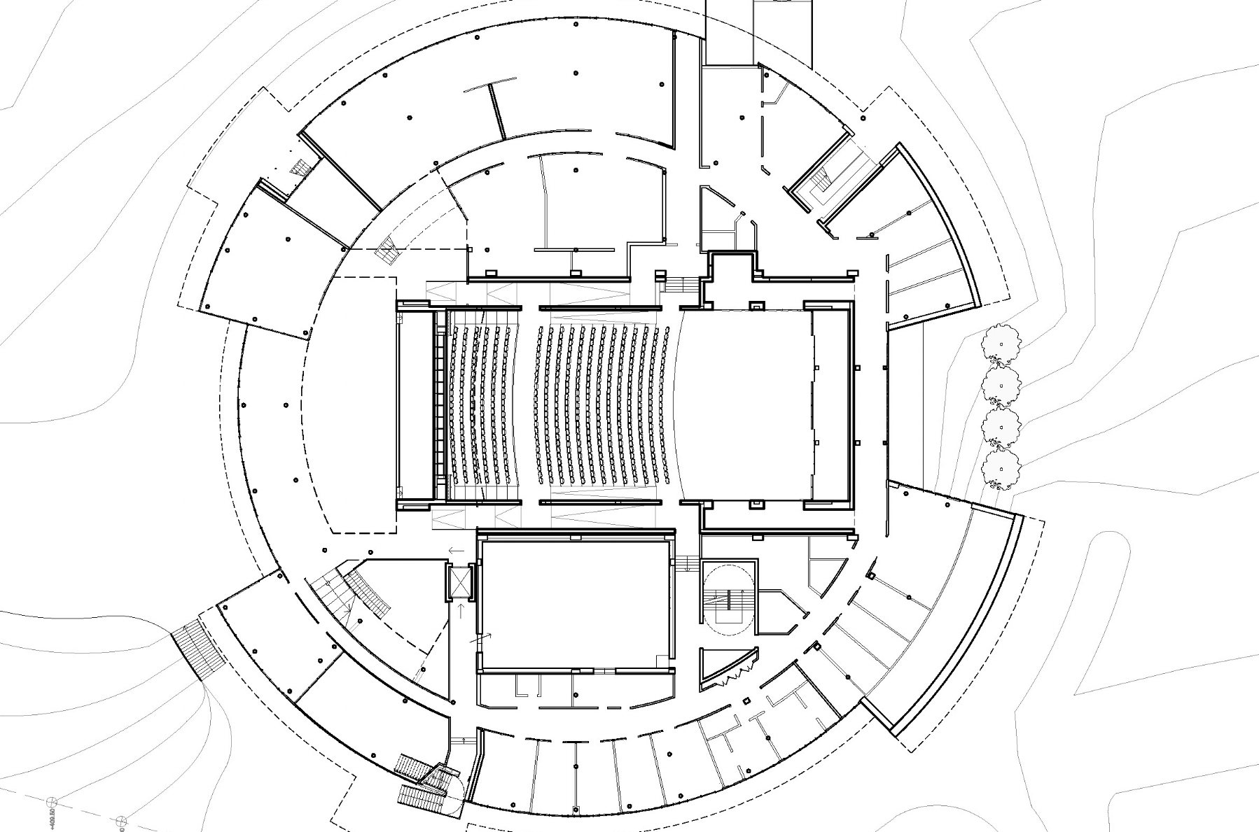 Plan showing centrally-located concert hall with perimeter offices and classrooms.