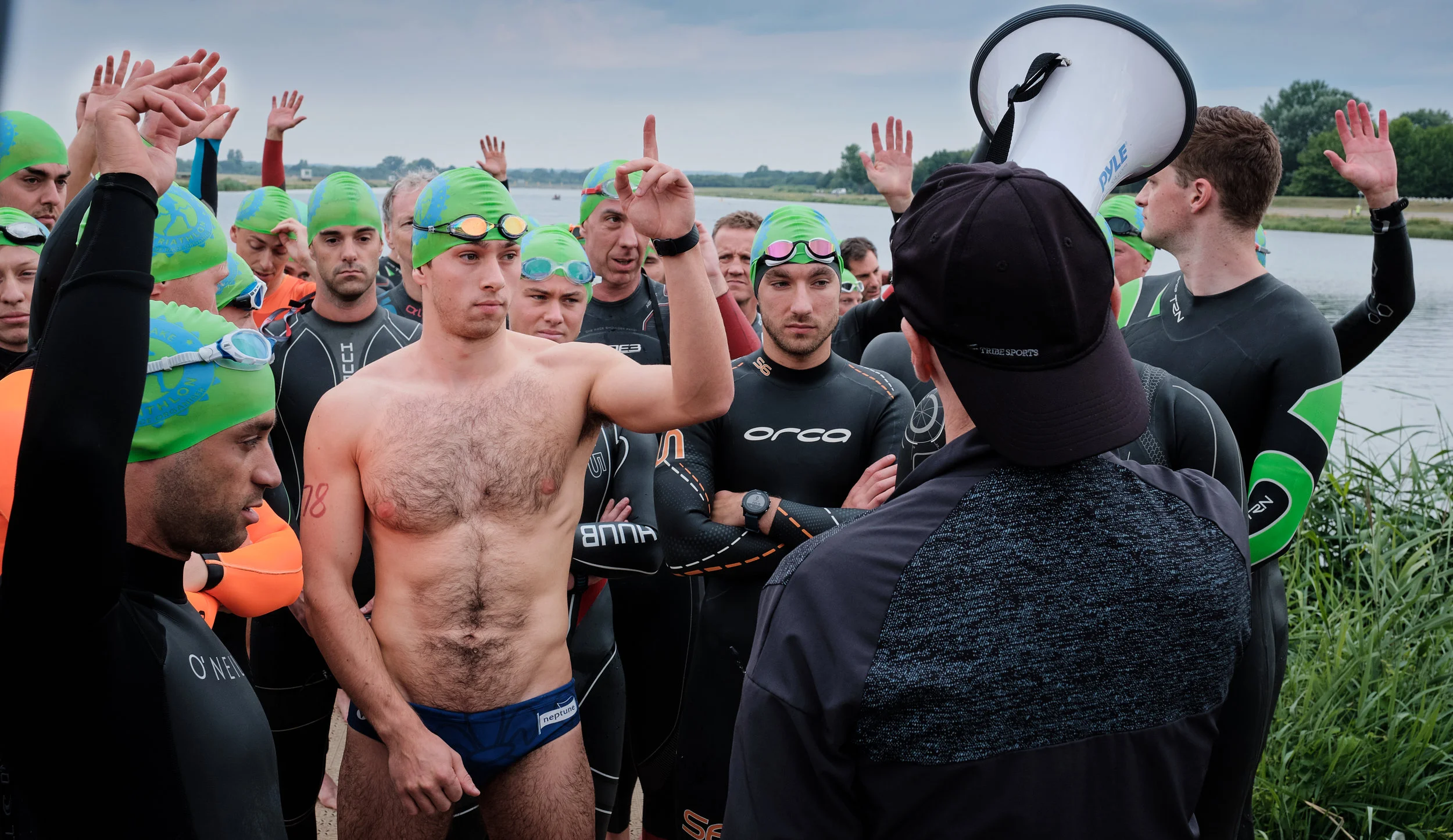 Triathlon from “The Race Organisers”, Sunday 4th August 2019, Dorney lake, UK. Competitors from the Man’s wave listen to the technical instructor.